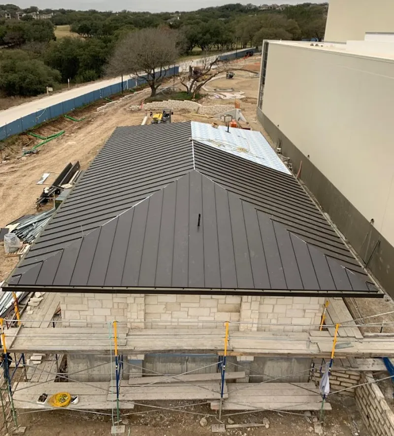 Metal roof new construction with scaffolding in Edison